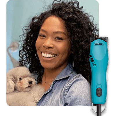 Female dog groomer portrait pictured with a Wahl KM10 clipper